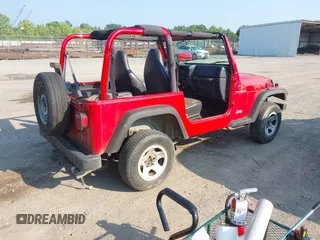 2000 Jeep Wrangler SE with VIN 1J4FA29P6YP775127, listed as a IAAI auction lot 42377387 with Not provided miles and . Bid and sale history available at DreamBid. Image 4.
