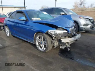 2015 BMW 2 Series 228i with VIN WBA1F5C59FVW98205, listed as a IAAI auction lot 41722804 with 91,879 mi miles. Bid and sale history available at carsss.com. Image 1.