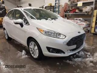 2017 Ford Fiesta Titanium with VIN 3FADP4CJ2HM123869, listed as a IAAI auction lot 41571724 with 103,452 mi miles. Bid and sale history available at carsss.com. Image 1.