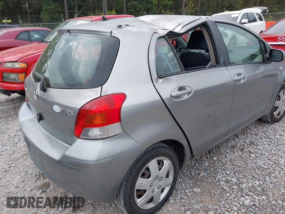 2010 Toyota Yaris z VIN JTDKT4K38A5296999, wystawiony jako IAAI lot #41878127 z przebiegiem 122 692 mil mil oraz . Historia ofert i sprzedaży dostępna na DreamBid. Obrazek 4.