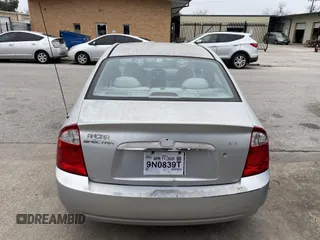 2004 Kia Spectra LX with VIN KNAFE121845043143, listed as a IAAI auction lot 41574523 with 211,758 mi miles. Bid and sale history available at carsss.com. Image 12.