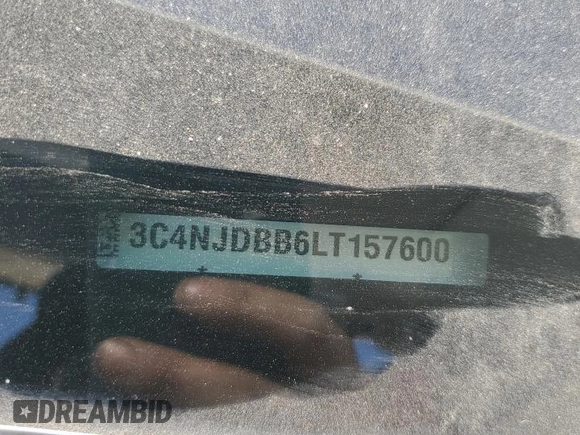 2020 Jeep Compass Latitude with VIN 3C4NJDBB6LT157600, listed as a Copart auction lot 52411235 with 82,159 mi miles and Salvage title. Bid and sale history available at DreamBid. Image 13.