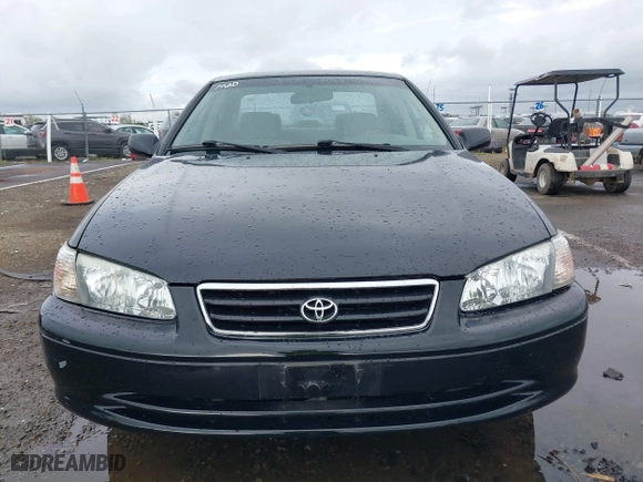 2000 Toyota Camry CE with VIN JT2BG22KXY0432288, listed as a IAAI auction lot 41927856 with 203,035 mi miles. Bid and sale history available at carsss.com. Image 6.