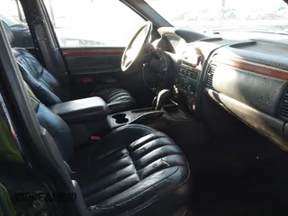 1999 Jeep Grand Cherokee Limited with VIN 1J4GW68N6XC675399, listed as a IAAI auction lot 41745815 with 217,800 mi miles. Bid and sale history available at carsss.com. Image 5.