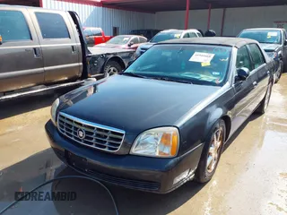 2001 Cadillac DeVille DHS z VIN 1G6KE57YX1U190955, wystawiony jako IAAI lot #41941668 z przebiegiem 191 040 mil mil oraz . Historia ofert i sprzedaży dostępna na DreamBid. Obrazek 6.