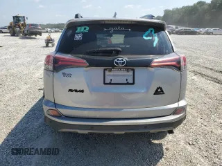 2018 Toyota RAV4 XLE with VIN 2T3WFREVXJW427748, listed as a Copart auction lot 61833055 with 104,057 mi miles and Salvage title. Bid and sale history available at DreamBid. Image 6.