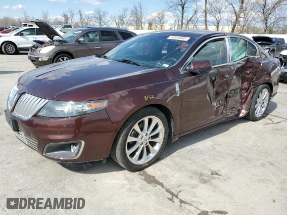 2012 Lincoln MKS EcoBoost with VIN 1LNHL9FT0CG800031, listed as a Copart auction lot 50520885 with 101,080 mi miles and Salvage title. Bid and sale history available at DreamBid. Image 1.