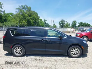 2023 Chrysler Pacifica Touring L with VIN 2C4RC1BG1PR606504, listed as a IAAI auction lot 42647652 with 41,598 mi miles and . Bid and sale history available at DreamBid. Image 14.
