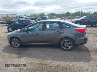 2018 Ford Focus SE z VIN 1FADP3FE5JL228583, wystawiony jako IAAI lot #42313614 z przebiegiem 84 240 mil mil oraz . Historia ofert i sprzedaży dostępna na DreamBid. Obrazek 14.