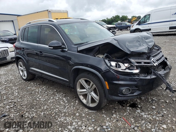 2014 Volkswagen Tiguan SEL with VIN WVGAV3AX7EW101796, listed as a Copart auction lot 60904345 with 97,652 mi miles and Salvage title. Bid and sale history available at DreamBid. Image 4.