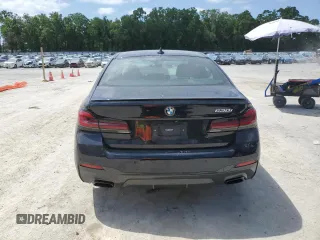 2023 BMW 5 Series 530i with VIN WBA53BH04PWY02486, listed as a Copart auction lot 54519385 with 26,979 mi miles and Salvage title. Bid and sale history available at DreamBid. Image 6.