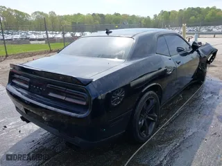 2015 Dodge Challenger SXT Plus with VIN 2C3CDZBG3FH724659, listed as a IAAI auction lot 41991083 with 148,984 mi miles. Bid and sale history available at carsss.com. Image 4.