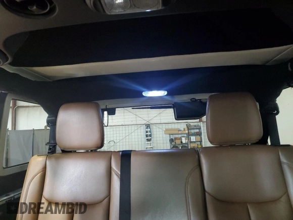 2015 Jeep Wrangler Unlimited Sahara с VIN 1C4HJWEG0FL560973, выставлен на аукционе Copart как лот 59552135 с пробегом 135 057 миль миль и Чистый • Clean title. История ставок и продаж доступна на DreamBid. Изображение 10.