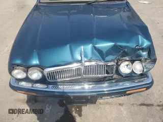 1996 Jaguar XJ z VIN SAJHX1746TC756451, wystawiony jako Copart lot #48991655 z przebiegiem 115 015 mil mil oraz Szkoda całkowita • Salvage title. Historia ofert i sprzedaży dostępna na DreamBid. Obrazek 12.