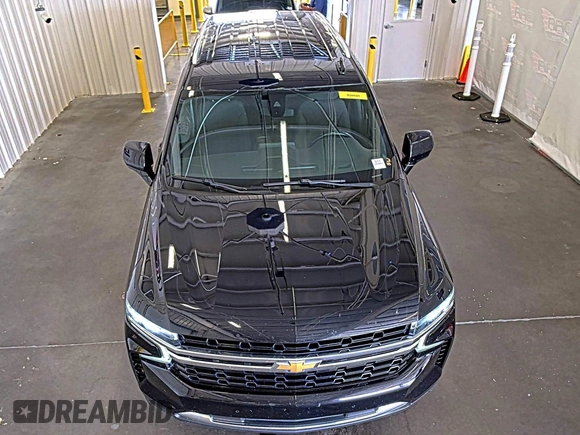 2022 Chevrolet Tahoe LS z VIN 1GNSKMKD7NR129745, wystawiony jako IAAI lot #42566236 z przebiegiem 95 126 mil mil oraz . Historia ofert i sprzedaży dostępna na DreamBid. Obrazek 5.