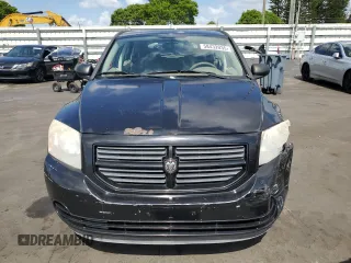 2008 Dodge Caliber SE z VIN 1B3HB28B18D776111, wystawiony jako Copart lot #58432035 z przebiegiem 106 065 mil mil oraz Szkoda całkowita • Salvage title. Historia ofert i sprzedaży dostępna na DreamBid. Obrazek 5.