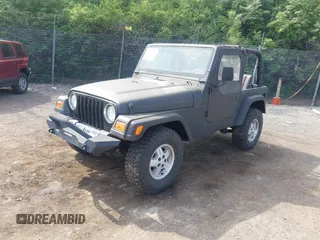 1999 Jeep Wrangler SE z VIN 1J4FY29P3XP469786, wystawiony jako IAAI lot #42131018 z przebiegiem 130 918 mil mil oraz . Historia ofert i sprzedaży dostępna na DreamBid. Obrazek 2.