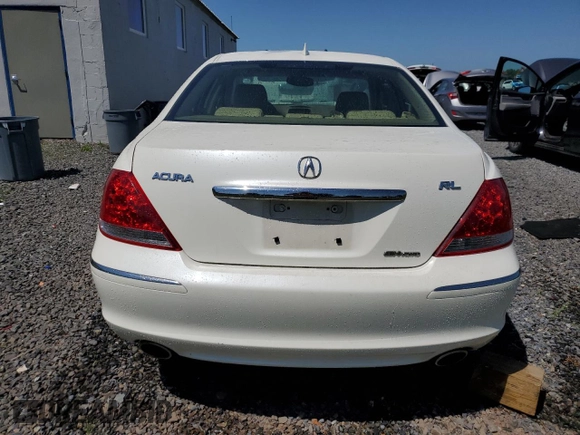 2006 Acura RL z VIN JH4KB16576C012132, wystawiony jako Copart lot #61897805 z przebiegiem 143 101 mil mil oraz Szkoda całkowita • Salvage title. Historia ofert i sprzedaży dostępna na DreamBid. Obrazek 6.