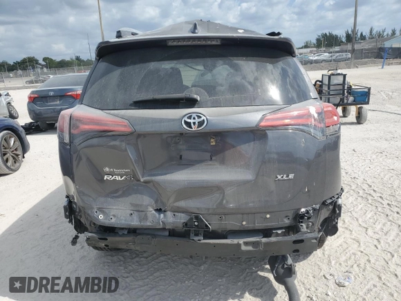 2018 Toyota RAV4 XLE with VIN 2T3WFREV0JW409386, listed as a Copart auction lot 53428615 with 91,999 mi miles and Salvage Title. Bid and sale history available at carsss.com. Image 6.