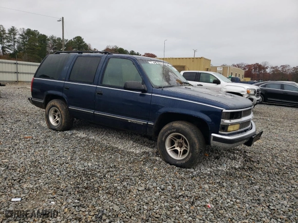 1999 Chevrolet Tahoe with VIN 1GNEC13R3XJ325377, listed as a Copart auction lot 83991974 with 257,816 mi miles and Salvage Title. Bid and sale history available at carsss.com. Image 4.