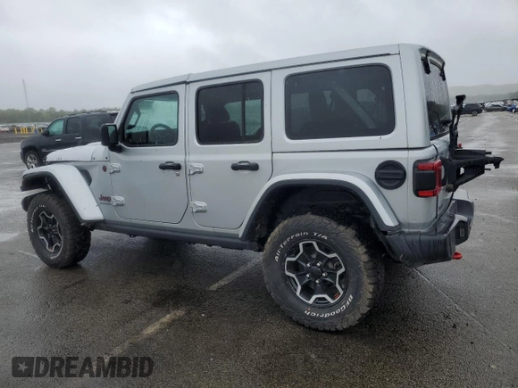 2023 Jeep Wrangler Rubicon with VIN 1C4JJXFM4PW589923, listed as a Copart auction lot 58725465 with 9,814 mi miles and Salvage title. Bid and sale history available at DreamBid. Image 2.