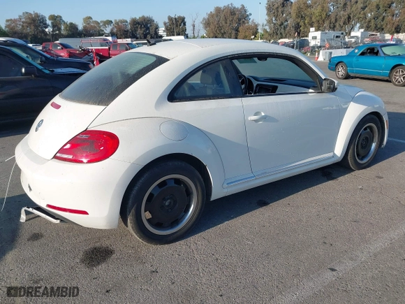 2012 Volkswagen Beetle 2.5L PZEV with VIN 3VWJP7AT3CM664552, listed as a IAAI auction lot 42077635 with 96,195 mi miles. Bid and sale history available at carsss.com. Image 4.