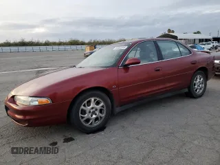 2001 Oldsmobile Intrigue GLS z VIN 1G3WX52H81F216327, wystawiony jako Copart lot #84892344 z przebiegiem 88 052 mil mil oraz Szkody całkowita. Historia ofert i sprzedaży dostępna na DreamBid. Obrazek 1.