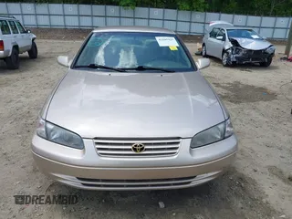 1997 Toyota Camry LE z VIN 4T1BG22K7VU818805, wystawiony jako IAAI lot #42105925 z przebiegiem 140 960 mil mil oraz . Historia ofert i sprzedaży dostępna na DreamBid. Obrazek 12.