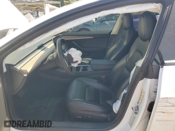 2023 Tesla Model 3 with VIN 5YJ3E1EA8PF394705, listed as a Copart auction lot 52319945 with 58,193 mi miles and Salvage title. Bid and sale history available at DreamBid. Image 7.