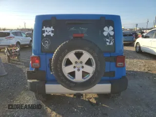 2011 Jeep Wrangler Sahara with VIN 1J4GA5D15BL632709, listed as a Copart auction lot 84118104 with 87,644 mi miles and Salvage Title. Bid and sale history available at DreamBid. Image 6.