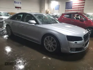 2015 Audi A8 with VIN WAUJGAFD1FN011100, listed as a Copart auction lot 49166055 with 38,575 mi miles and Salvage title. Bid and sale history available at DreamBid. Image 4.
