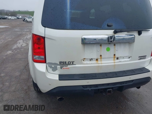 2013 Honda Pilot Touring with VIN 5FNYF4H95DB011661, listed as a IAAI auction lot 42101104 with 298,004 mi miles and . Bid and sale history available at carsss.com. Image 6.