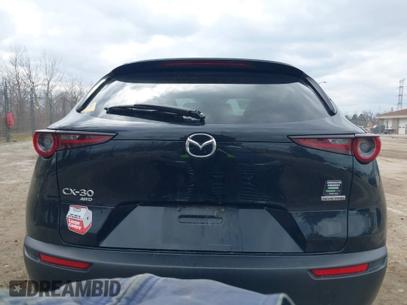 2021 Mazda CX-30 Preferred z VIN 3MVDMBCL5MM205824, wystawiony jako IAAI lot #41991942 z przebiegiem 58 112 mil mil oraz . Historia ofert i sprzedaży dostępna na DreamBid. Obrazek 16.