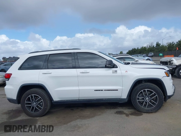 2018 Jeep Grand Cherokee Trailhawk with VIN 1C4RJFLT2JC137793, listed as a IAAI auction lot 41697299 with 149,100 mi miles and . Bid and sale history available at DreamBid. Image 13.
