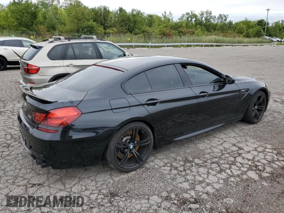 2015 BMW M6 z VIN WBS6C9C59FD467652, wystawiony jako Copart lot #66093293 z przebiegiem Nie podano mil oraz . Historia ofert i sprzedaży dostępna na DreamBid. Obrazek 3.