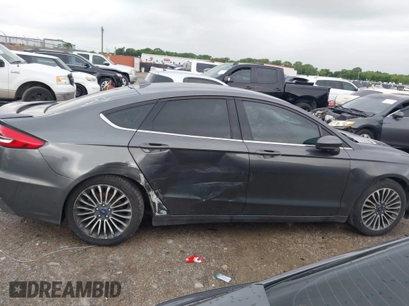 2020 Ford Fusion SE z VIN 3FA6P0HD5LR198744, wystawiony jako IAAI lot #42177820 z przebiegiem 97 520 mil mil oraz . Historia ofert i sprzedaży dostępna na DreamBid. Obrazek 13.