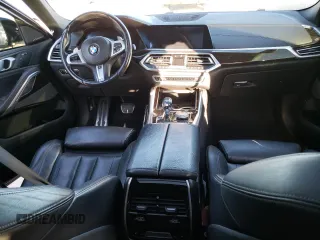 2020 BMW X6 xDrive40i z VIN 5UXCY6C03L9D00816, wystawiony jako Copart lot #76538674 z przebiegiem Nie podano mil oraz Szkoda całkowita • Salvage title. Historia ofert i sprzedaży dostępna na DreamBid. Obrazek 8.