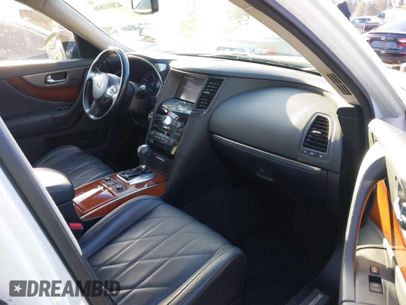 2014 Infiniti QX70 with VIN JN8CS1MW2EM411237, listed as a IAAI auction lot 42011806 with 148,133 mi miles and . Bid and sale history available at carsss.com. Image 5.