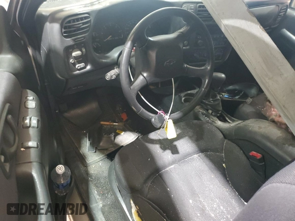 2004 Chevrolet Blazer LS z VIN 1GNCT18X34K143280, wystawiony jako Copart lot #50494785 z przebiegiem Nie podano mil oraz Szkoda całkowita • Salvage title. Historia ofert i sprzedaży dostępna na DreamBid. Obrazek 8.