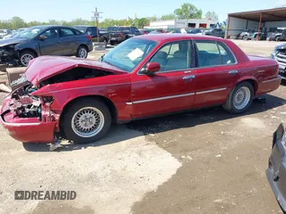 2002 Mercury Grand Marquis LS Premium z VIN 2MEFM75W22X653775, wystawiony jako IAAI lot #42225138 z przebiegiem 124 749 mil mil oraz . Historia ofert i sprzedaży dostępna na DreamBid. Obrazek 2.
