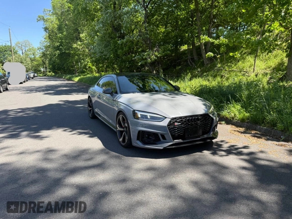 2018 Audi RS 5 z VIN WUAPWAF50JA904659, wystawiony jako Copart lot #57560835 z przebiegiem 88 168 mil mil oraz Tytuł czysty. Historia ofert i sprzedaży dostępna na DreamBid. Obrazek 1.
