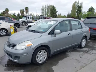 2011 Nissan Versa 1.8 S with VIN 3N1BC1AP0BL461824, listed as a IAAI auction lot 42076994 with 180,798 mi miles. Bid and sale history available at carsss.com. Image 6.