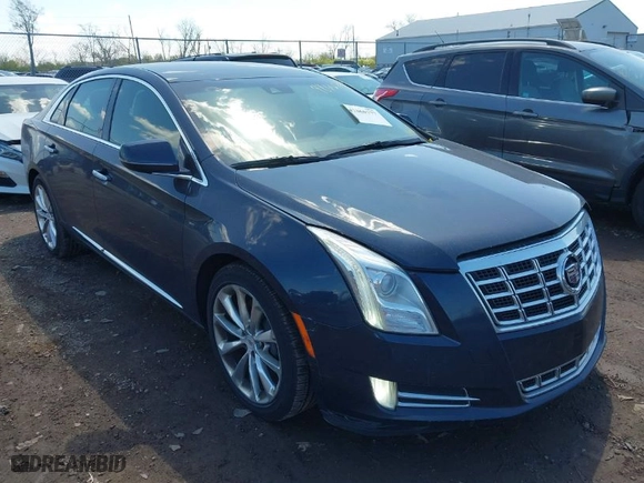 2013 Cadillac XTS Luxury with VIN 2G61P5S33D9162806, listed as a IAAI auction lot 42060777 with 168,896 mi miles. Bid and sale history available at carsss.com. Image 1.
