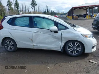 2019 Honda Fit EX z VIN 3HGGK5H88KM716257, wystawiony jako IAAI lot #41936677 z przebiegiem 133 463 mil mil oraz . Historia ofert i sprzedaży dostępna na DreamBid. Obrazek 13.