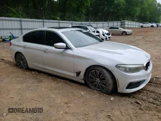 2018 BMW 5 Series 530i with VIN WBAJA5C53JG898430, listed as a Copart auction lot 54243195 with 129,854 mi miles and Salvage title. Bid and sale history available at DreamBid. Image 4.