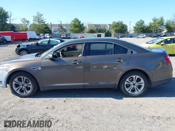 2015 Ford Taurus SEL with VIN 1FAHP2E83FG206055, listed as a IAAI auction lot 41943670 with 90,808 mi miles and . Bid and sale history available at carsss.com. Image 14.