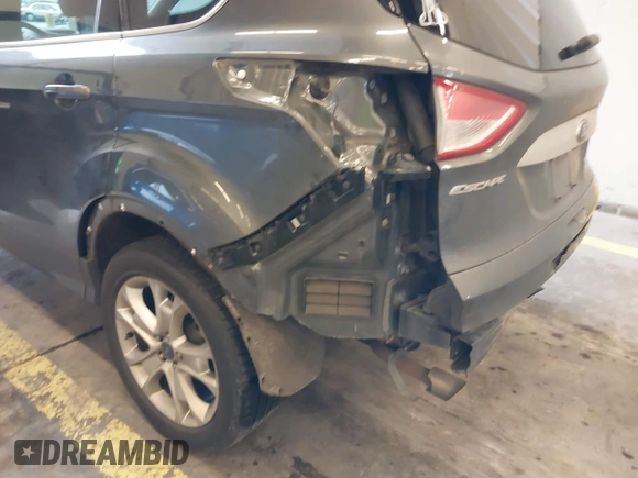 2016 Ford Escape Titanium with VIN 1FMCU9J92GUB63525, listed as a IAAI auction lot 41469824 with 156,773 mi miles. Bid and sale history available at carsss.com. Image 21.