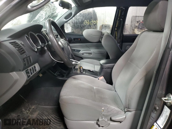 2014 Toyota Tacoma with VIN 5TFLU4ENXEX089927, listed as a Copart auction lot 52140565 with 112,924 mi miles and Salvage Title. Bid and sale history available at DreamBid. Image 7.