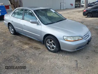 2002 Honda Accord SE z VIN JHMCG66802C027742, wystawiony jako IAAI lot #42373110 z przebiegiem 141 167 mil mil oraz . Historia ofert i sprzedaży dostępna na DreamBid. Obrazek 1.