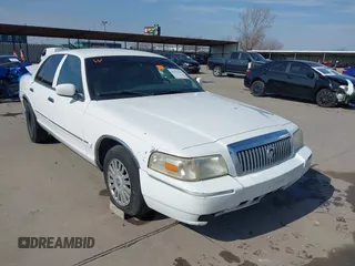 2007 Mercury Grand Marquis LS z VIN 2MEFM75V47X627063, wystawiony jako IAAI lot #41277942 z przebiegiem 161 830 mil mil oraz . Historia ofert i sprzedaży dostępna na DreamBid. Obrazek 1.